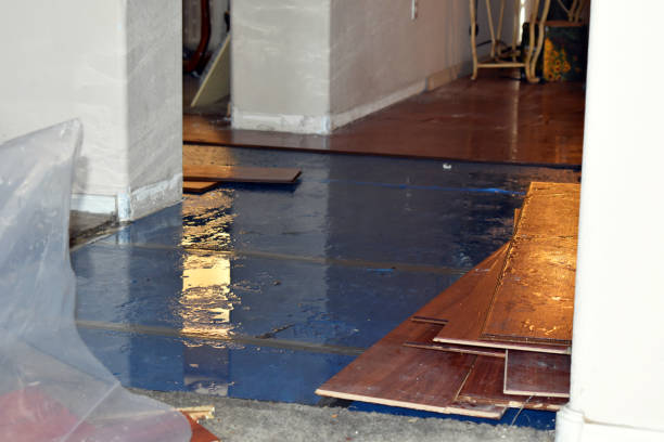 Professional Flood Damage Restoration technician working in Ashville, OH